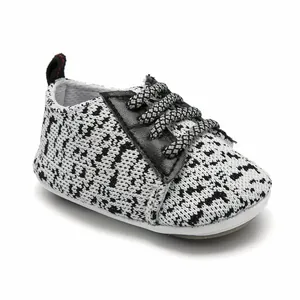 A detailed view of breathable knit baby walker shoes featuring a non-slip rubber sole