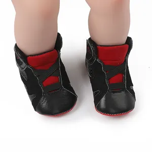 Close-up of black and red infant basketball shoes with soft anti-slip soles.
