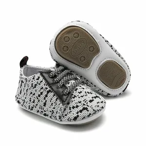 Detailed view of breathable knitted baby walker sneakers with anti-slip rubber sole