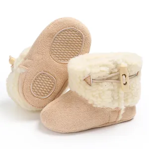 Close-up of cozy baby winter snow boots with soft fleece lining and wooden toggle button