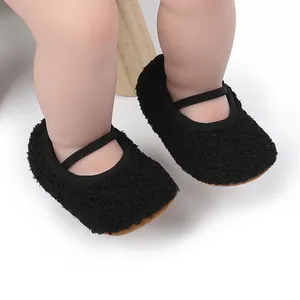 Detailed close-up showing black fuzzy infant Mary Jane walking shoes for newborns and babies