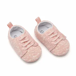Top view of pink knit breathable baby walking sneakers featuring soft laces and pull tab