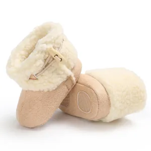 Macro view showing anti-slip sole and warm fleece lining on baby winter snow boots