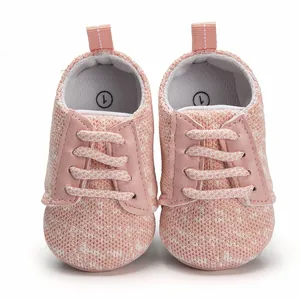 High quality front view of pink breathable knit infant walking shoes with faux laces