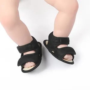 Detailed close-up of black breathable mesh baby sandals with adjustable straps for summer