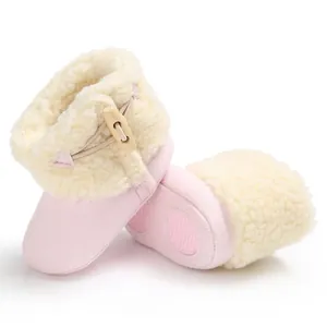 Soft pink baby winter snow boots with warm faux fur lining and anti-slip soles.