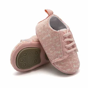 Close-up of pink breathable knitted baby walker shoes with anti-slip rubber sole