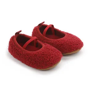 Detail view of soft red fuzzy baby pre-walker shoes featuring a comfortable elastic strap