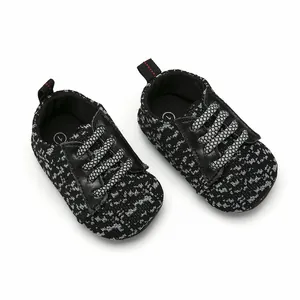 Detail view showing the knitted pattern and secure laces of breathable baby walking sneakers