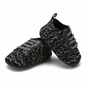 Close-up shot of breathable knitted baby walking shoes with black and grey pattern