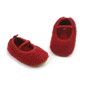 Detailed macro shot of red sherpa fleece baby walker shoes featuring comfortable elastic straps