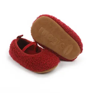 Bottom view and side angle of cozy red plush baby prewalker shoes with non-slip soles