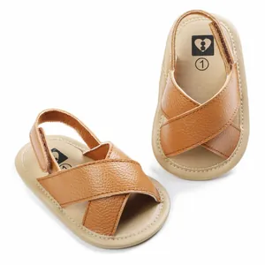 Brown faux leather crisscross baby walking sandals with adjustable back strap and soft sole