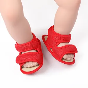 Close-up of breathable red mesh toddler walking shoes with secure double Velcro straps