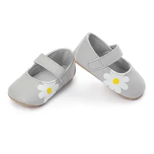Grey baby walking shoes with white daisy pattern, high-quality leather detail view