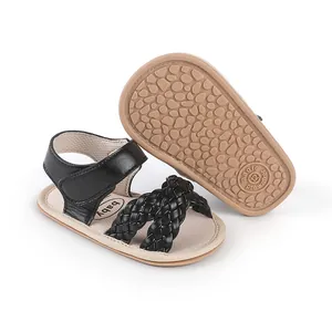 Detail view of black braided baby girl sandals prewalker with soft non-slip rubber soles