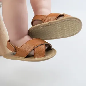 Brown faux leather baby boy walker sandals with cross-straps and non-slip soft soles