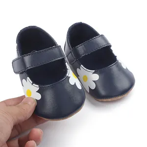 Detail of navy blue infant walking shoes with daisy pattern for 0-1 year old babies