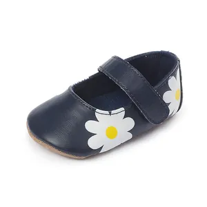 Navy blue baby walker shoe featuring a white daisy floral print and velcro strap