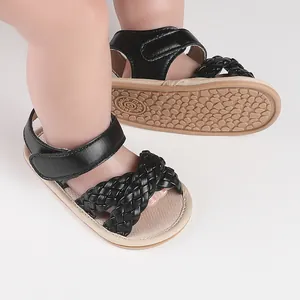 Stylish black braided leather baby sandals for 3-12 months infants with non-slip soles.
