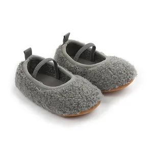 Close-up of grey fuzzy sherpa baby Mary Jane shoes with elastic strap for walking