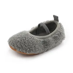 Detailed view of grey fuzzy sherpa fleece baby walking shoe with an elastic strap