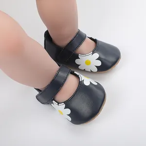 Detailed view of navy blue baby Mary Jane walking shoes with white daisy flower motifs