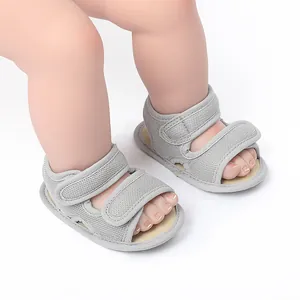 Close-up view of grey breathable mesh baby walking sandals with adjustable hook-and-loop straps
