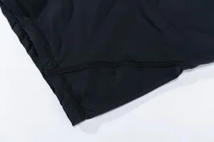 Macro detail of breathable quick-dry black cycling shorts fabric with flatlock seams