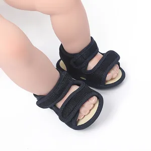 Detail view of navy blue mesh baby sandals with secure velcro straps for infants.