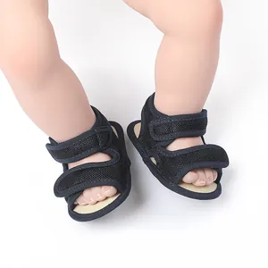 Detailed view of navy blue baby walking sandals with mesh upper and Velcro straps