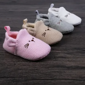 Soft knit baby walking shoes with embroidered cat face detail, four colors available.