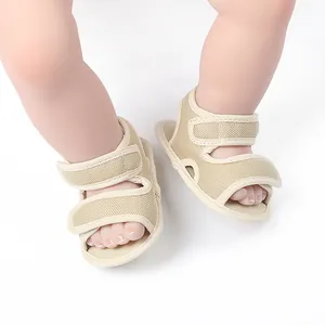Close-up of beige baby mesh sandals, perfect for summer indoor walking.