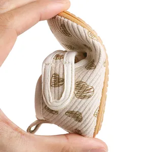 Detail view showing the flexible soft sole of corduroy heart print baby shoes