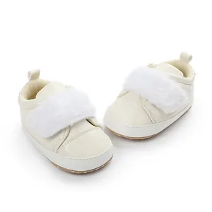 Detailed view of cream baby walker shoes with soft faux fur strap and anti-slip sole
