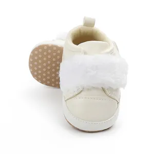 Detail of baby girl princess shoes featuring white faux fur and non-slip soft sole