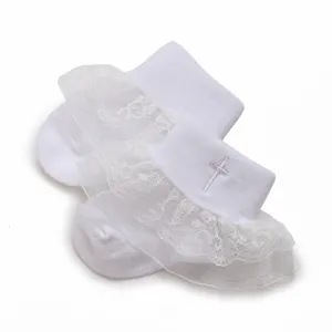 Soft white baby socks with lace ruffles and embroidered cross for infants 0-1 year