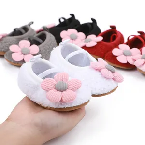 Soft plush baby walking shoes with decorative pink flower detail