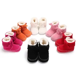 Multiple colors of fringe baby booties with soft soles and warm faux fur lining
