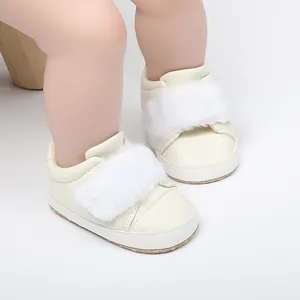 Macro detail of white infant princess pre-walker shoes featuring a soft non-slip sole and fur trim