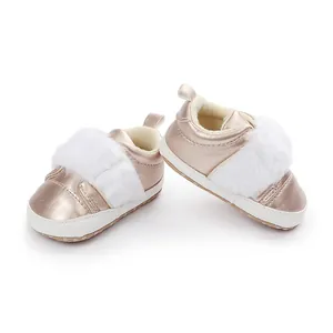 Detailed view of rose gold baby girl princess shoes with soft soles and white fur strap