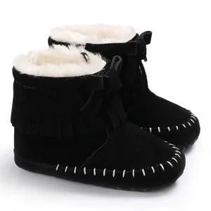 Black infant fringe moccasins with warm white faux fur lining and soft non-slip soles