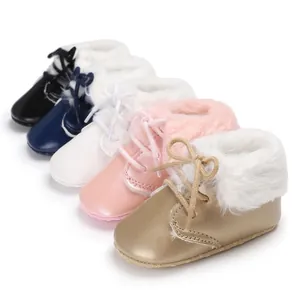 Detailed view of soft sole baby fur boots in gold pink white navy and black colors