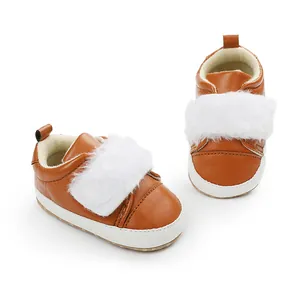 Brown baby princess shoes with white faux fur trim and soft soles for infants.