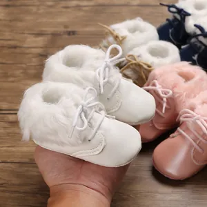 Detailed view of soft baby snow boots with fluffy faux fur lining in multiple colors