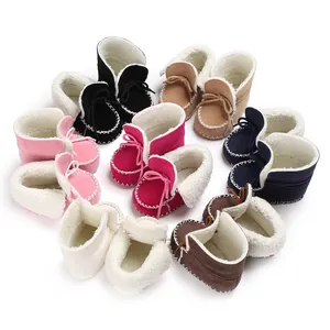 Variety of colorful infant plush boots with soft faux fur lining and decorative stitching.