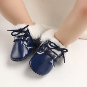 Cozy navy blue baby fur boots with soft soles and warm white faux fur lining for infants.