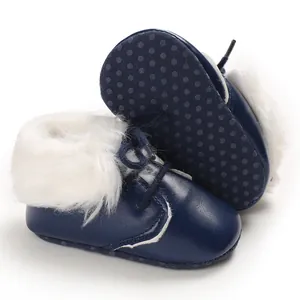 Cozy dark blue infant boots featuring white faux fur trim and non-slip soft soles