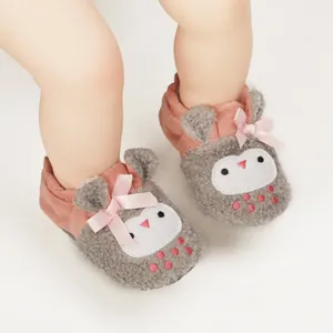 Detail showing soft fleece texture and cute owl design on pink baby walker shoes