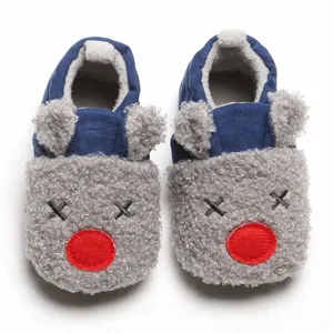 Warm cartoon baby cotton shoes with soft soles and reindeer design for winter indoors.